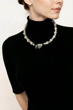 Black and white ceramic beads and silver spacer necklace with leaf clasp